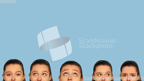 Image of Caucasian teen girl portrait isolated on blue studio background