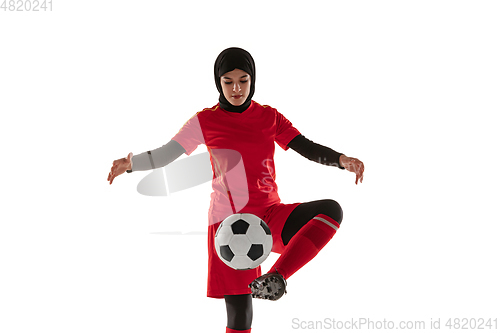 Image of Arabian female soccer or football player isolated on white studio background