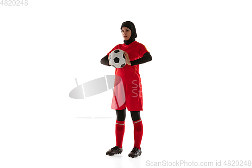 Image of Arabian female soccer or football player isolated on white studio background