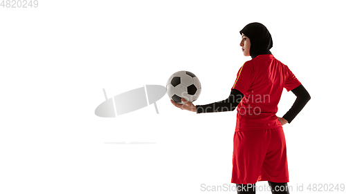 Image of Arabian female soccer or football player isolated on white studio background