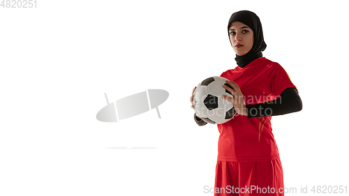 Image of Arabian female soccer or football player isolated on white studio background