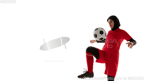 Image of Arabian female soccer or football player isolated on white studio background