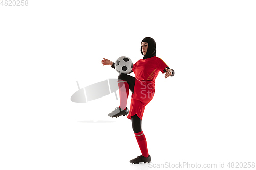 Image of Arabian female soccer or football player isolated on white studio background