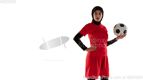 Image of Arabian female soccer or football player isolated on white studio background