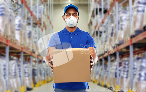 Image of indian delivery man with parcel box in respirator