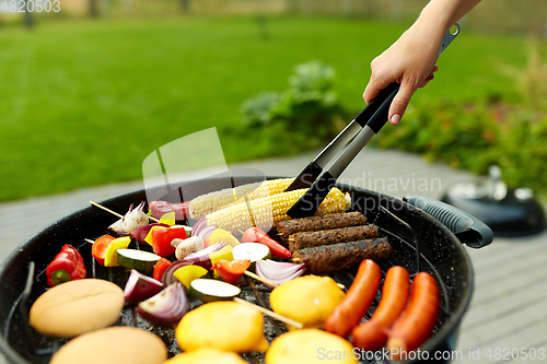 Image of barbecue kebab meat and vegetables on grill