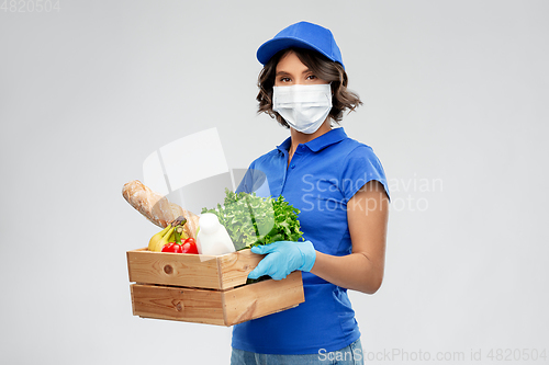 Image of delivery woman in face mask with food in box