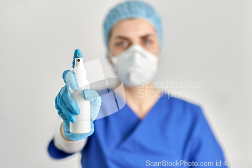 Image of close up of doctor or nurse with hand sanitizer