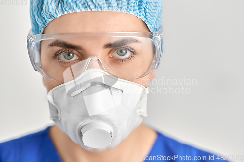 Image of doctor in goggles and protective face mask