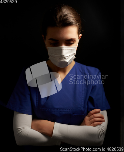 Image of female doctor or nurse in medical face mask