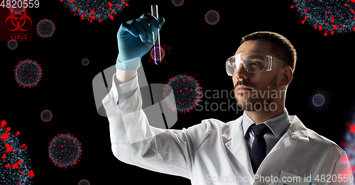 Image of scientist with coronavirus vaccine in test tube