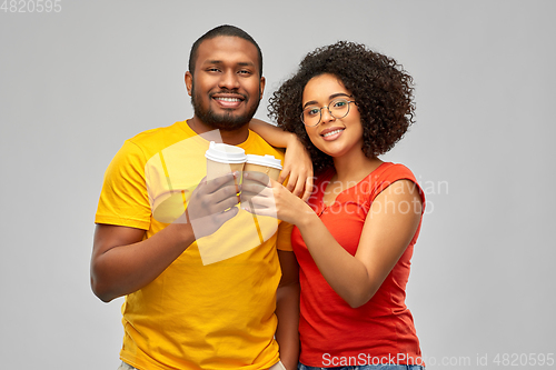 Image of happy african american couple with coffee cups