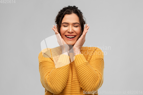 Image of happy smiling young woman with pierced nose