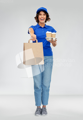 Image of delivery woman with coffee and food in paper bag