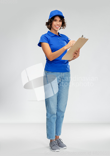 Image of happy smiling delivery woman with clipboard