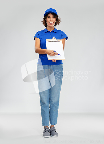 Image of happy smiling delivery woman with clipboard