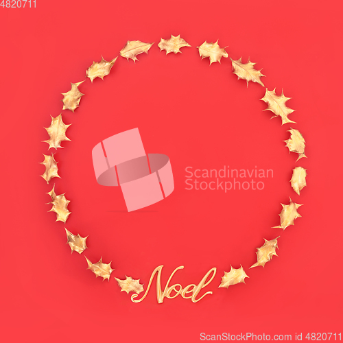 Image of Wreath with Gold Noel Sign and Holly Leaves