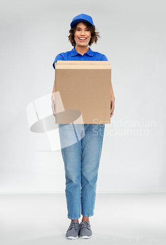 Image of happy smiling delivery woman with parcel box