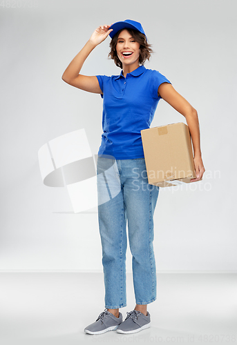 Image of happy smiling delivery woman with parcel box