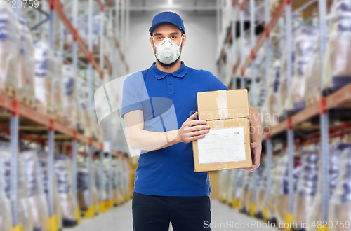 Image of delivery man in mask or respirator at warehouse