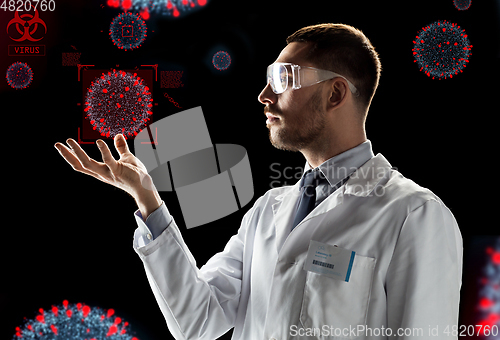 Image of scientist with coronavirus virtual projection