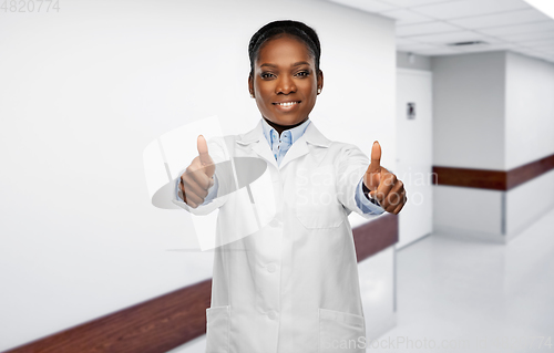 Image of african american female doctor showing thumbs up