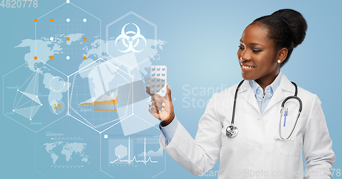 Image of african american female doctor with medicine pills