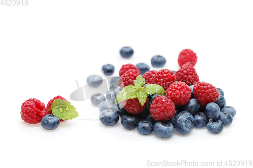 Image of blueberry and raspberry berries isolated on white background