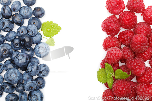 Image of blueberry and raspberry berries isolated on white background