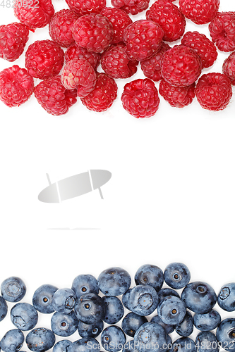 Image of blueberry and raspberry berries isolated on white background
