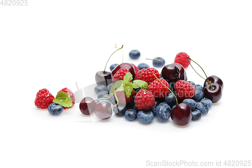 Image of blueberry, cherry and raspberry berries isolated on white background