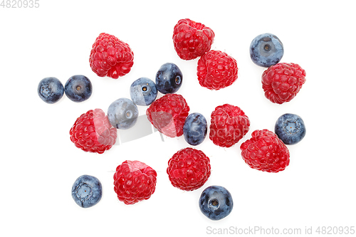 Image of blueberry and raspberry berries isolated on white background