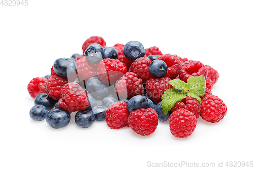 Image of blueberry and raspberry berries isolated on white background