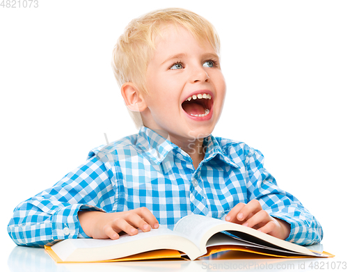 Image of Little child play with book