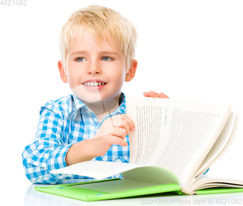 Image of Little child play with book
