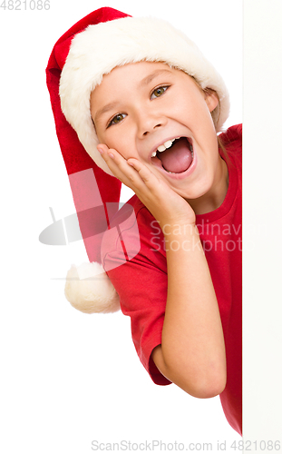 Image of Little girl is holding her face in astonishment