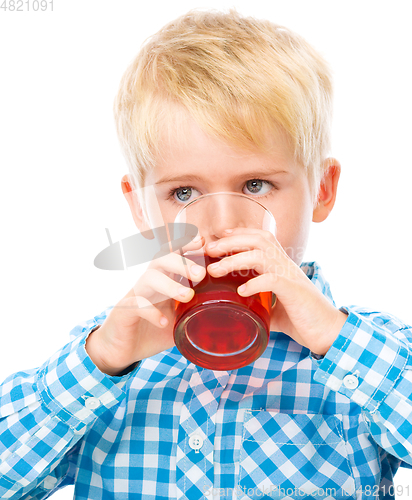 Image of Little boy with glass of cherry juice