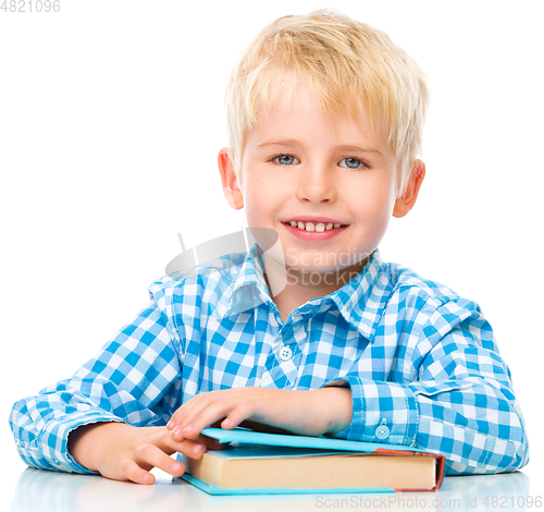 Image of Little child play with book