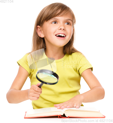 Image of Little girl is reading book