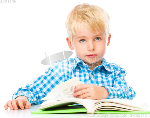 Image of Little child play with book