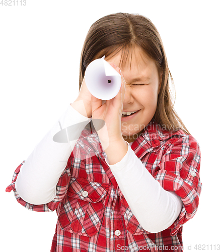 Image of Cute little girl is looking through spyglass