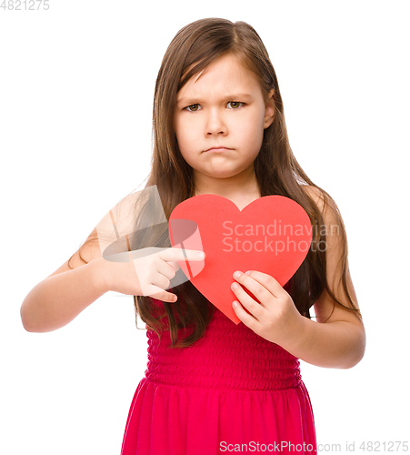 Image of Portrait of a sad little girl in red