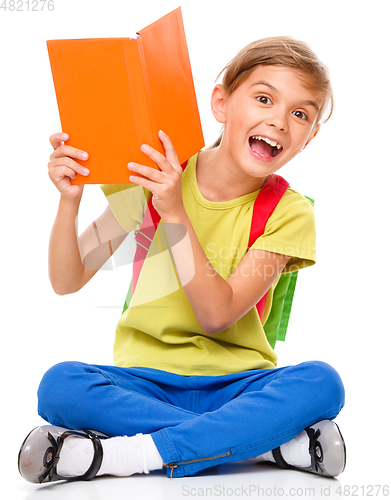 Image of Portrait of a cute little schoolgirl with backpack