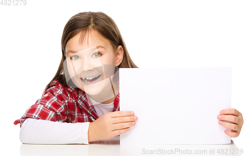 Image of Little girl is looking from out blank board