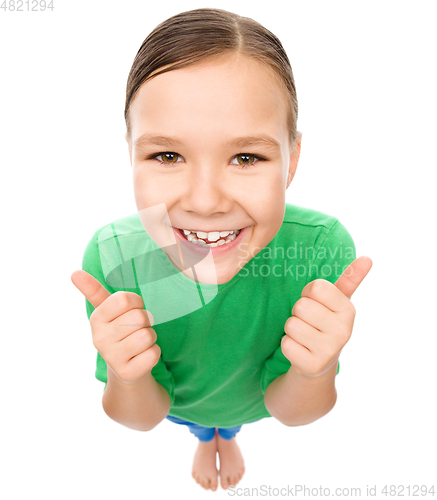 Image of Little girl is showing thumb up gesture