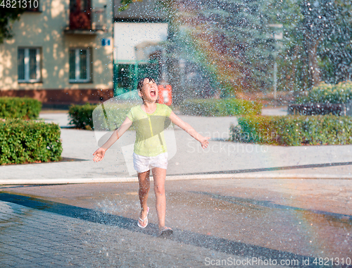 Image of Girl is running through fountains