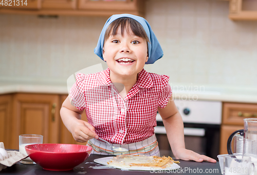 Image of Girl is cooking in kitchen