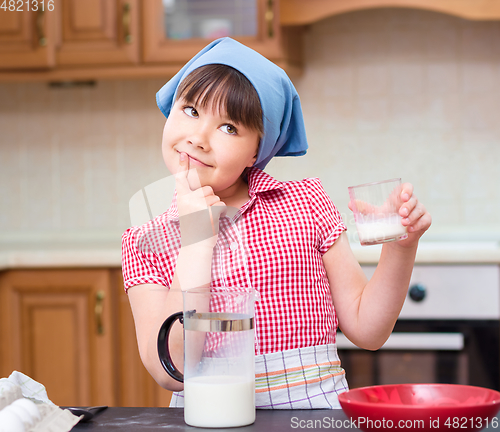 Image of Girl is cooking in kitchen