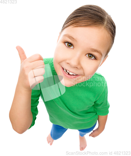 Image of Little girl is showing thumb up gesture