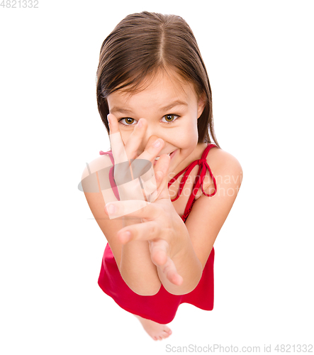 Image of Little girl in red dress showing big nose